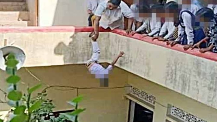 Arrestan a maestro que castigó a un menor colgándolo en un balcón