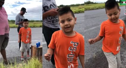 TIERNO VIDEO: Mientras adultos hacen rapiña, niño compra naranjas a trailero que volcó camión