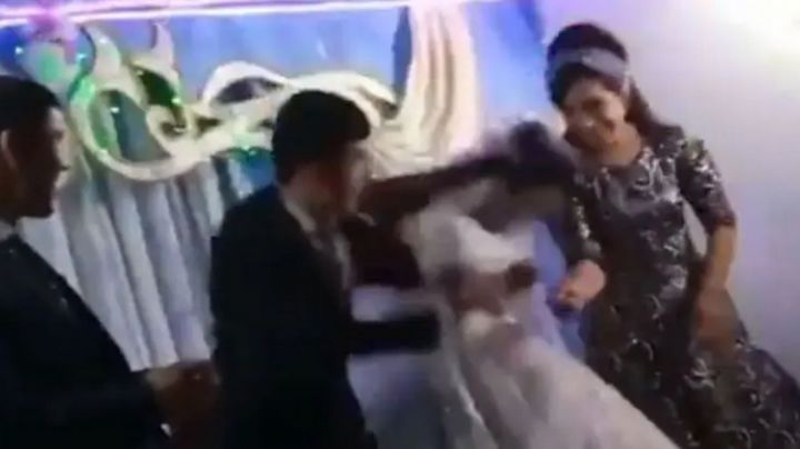 INDIGNANTE... Hombre golpea a su esposa en plena fiesta de la boda (VIDEO)