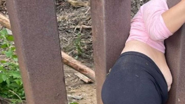 Mujer queda atrapada al tratar de cruzar el muro fronterizo; la abandonan 'coyotes'