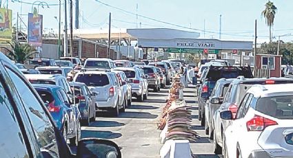 Trae puente escolar largas filas a cruces