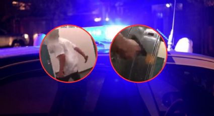 Momento en el que dos policías son arrinconados y abren fuego contra su agresor | VIDEO