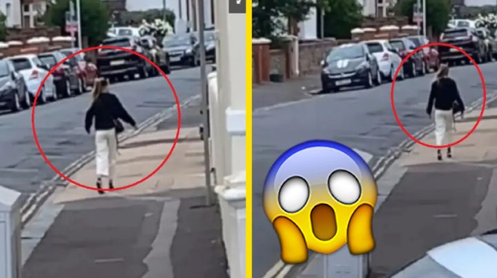¿Error en la Matrix? Mujer se queda 'congelada' en medio de la calle | VIDEO