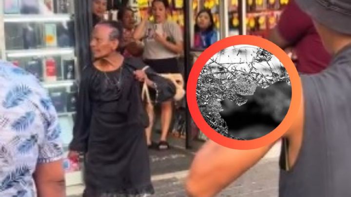 Mujer descontrolada rompe el vidrio de un local tras ser mojada por un desconocido | VIDEO