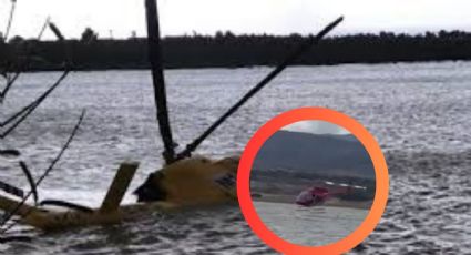 Helicóptero que recolectaba agua se estrella en presa; rescatan a 2 personas | VIDEO