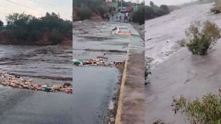 Auto queda varado en desborde del río por intensas lluvias; conductor sobrevive tras ignorar advertencias
